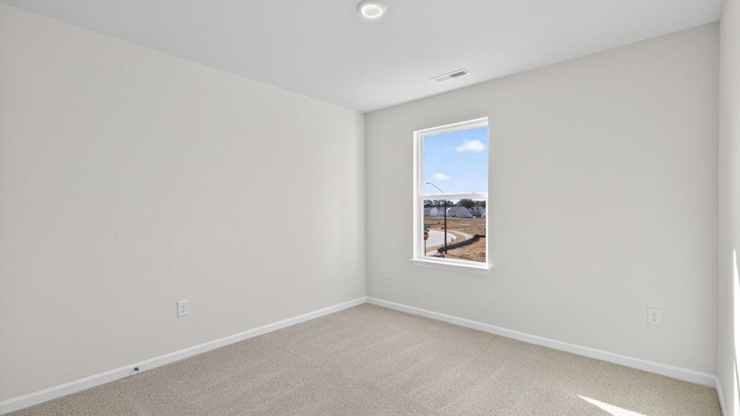 Spacious, unfurnished interior of a new home in The Townes at Honeycutt Oaks, Angier (Image 22).