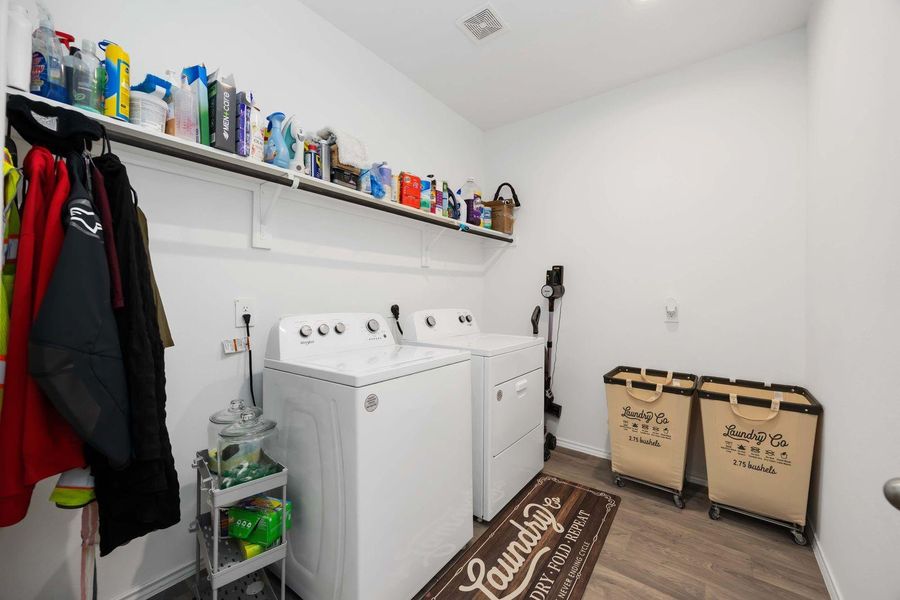 Walk-in laundry room conveniently located on the first floor Walk-in laundry room conveniently located on the first floor