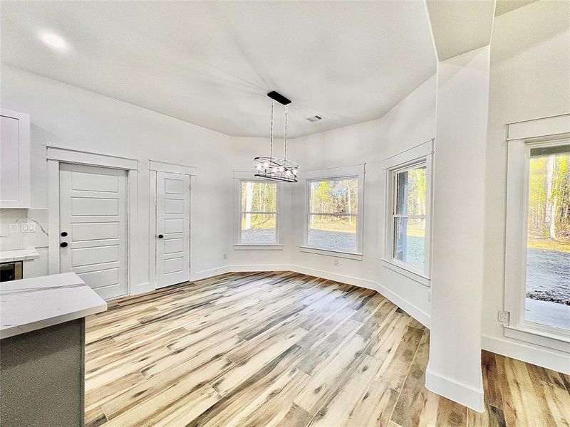 Formal Dining or Breakfast Room, LED Modern Light Fixtures, Huge Window for all that Natural Light Fill the Room.