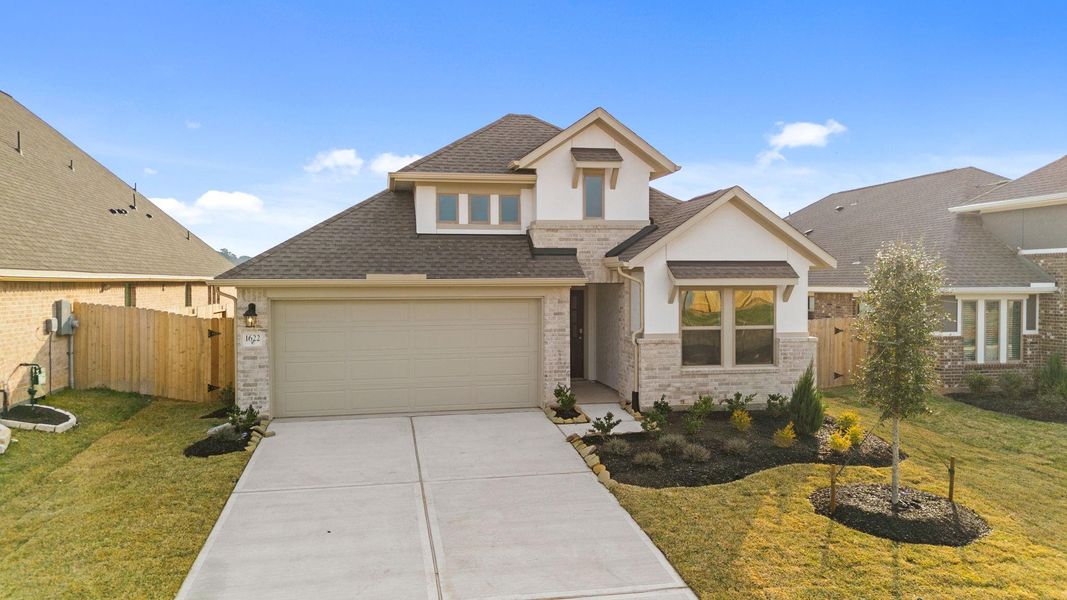 Front exterior of a new home in Escondido, Magnolia, TX, highlighting curb appeal (Image 23).