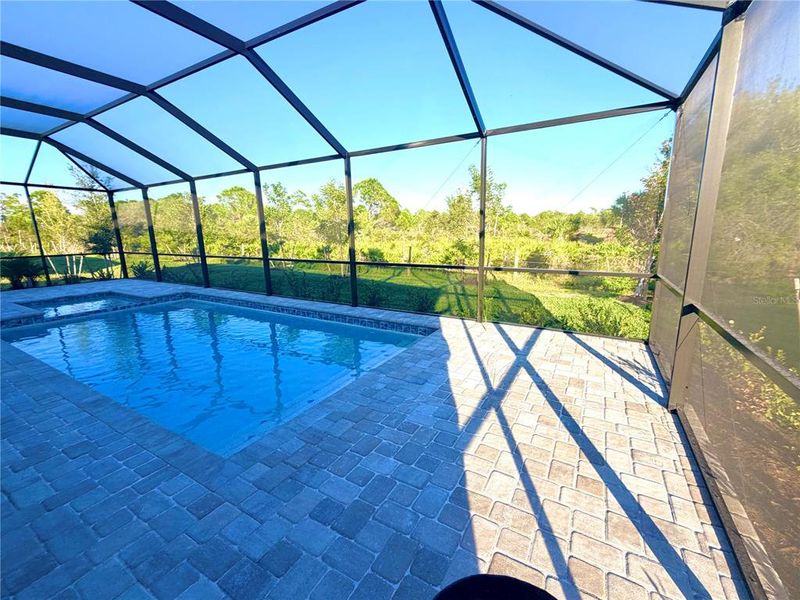 Exterior details and patio area of a home in Island Lakes at Coco Bay: Manor Homes, Englewood (Image 2).