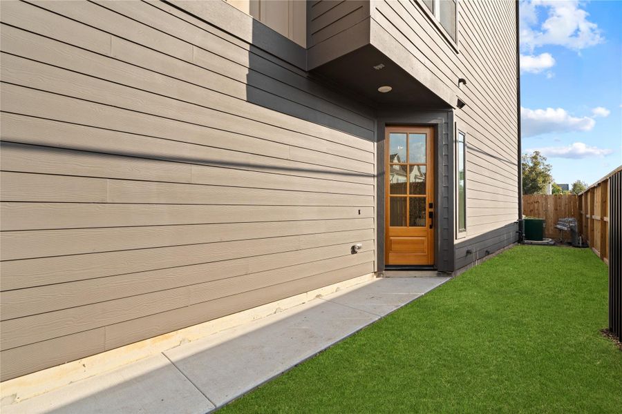 Privately gated side yard for extra green space and direct entry through the 8ft solid wood front door. Privately gated side yard for extra green space and direct entry through the 8ft solid wood front door.