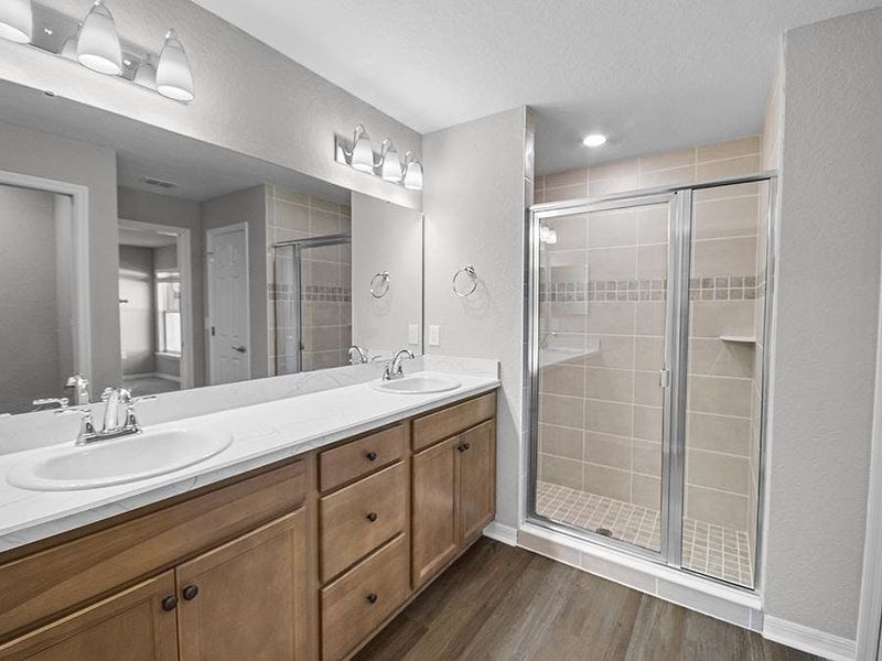 Your suite is complete with a walk-in wardrobe and a large en-suite bath.