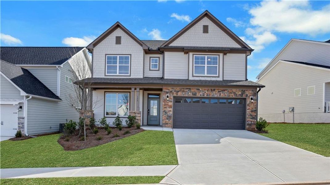 Front exterior of a new home in Twin Lakes, Hoschton, GA, highlighting curb appeal (Image 31).