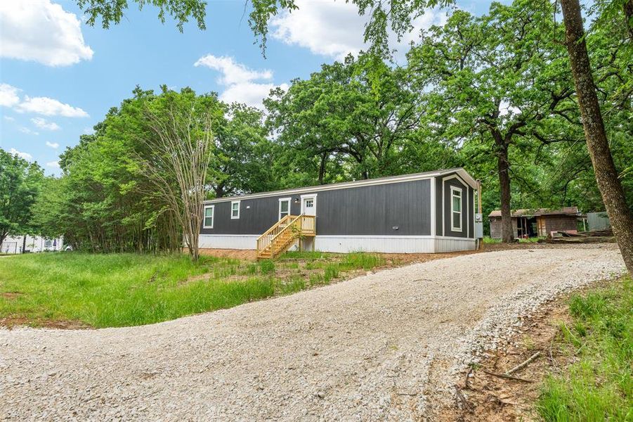 Front exterior of a new home in , Mabank, TX, highlighting curb appeal (Image 16). Front exterior of a new home in , Mabank, TX, highlighting curb appeal (Image 16).