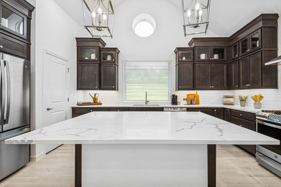 Stunning kitchen with dark stain cabinets and quartz countertops. Stunning kitchen with dark stain cabinets and quartz countertops.