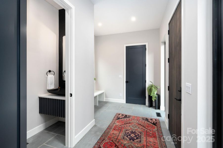 Beautifully Unique Dogtrot Entry with Blue Stone Flooring and Powder Room Beautifully Unique Dogtrot Entry with Blue Stone Flooring and Powder Room
