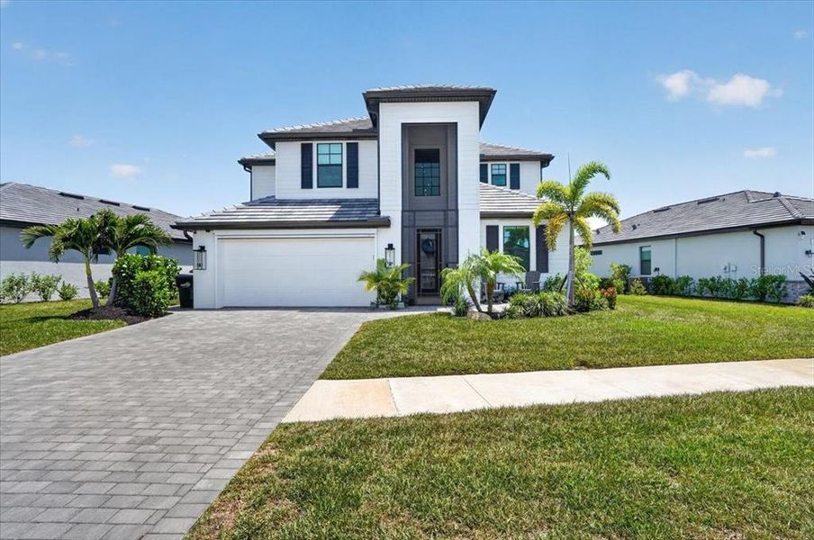 Front exterior of a new home in , Venice, FL, highlighting curb appeal (Image 25). Front exterior of a new home in , Venice, FL, highlighting curb appeal (Image 25).