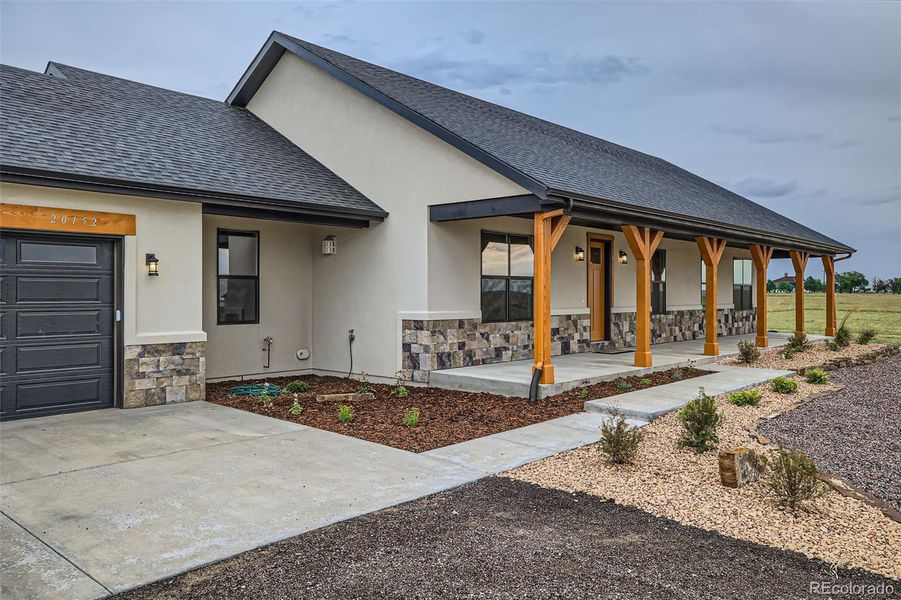 Front exterior of a new home in , Colorado Springs, CO, highlighting curb appeal (Image 21).