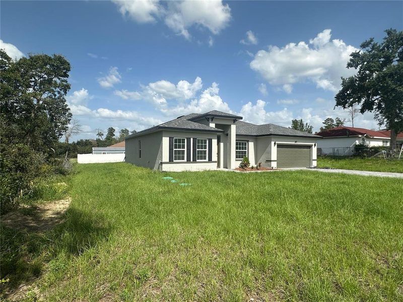 Front exterior of a new home in , Ocala, FL, highlighting curb appeal (Image 19).
