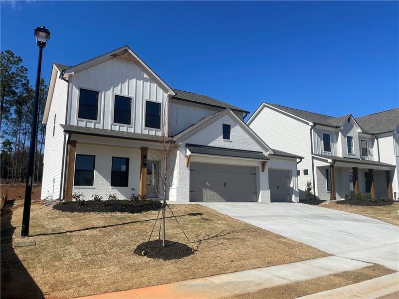 Front exterior of a new home in Summerlin, Winder, GA, highlighting curb appeal (Image 22).