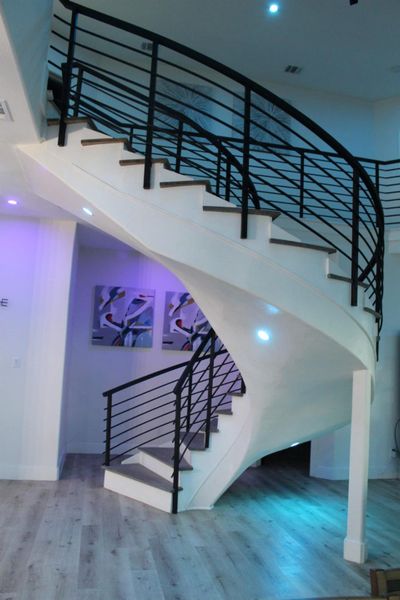 modern stair case with colorful recess light