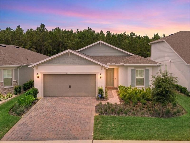 Front exterior of a new home in , Minneola, FL, highlighting curb appeal (Image 25). Front exterior of a new home in , Minneola, FL, highlighting curb appeal (Image 25).