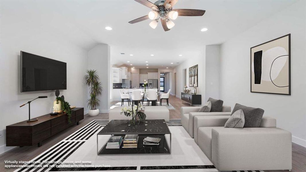 Living room with hardwood / wood-style flooring and ceiling fan