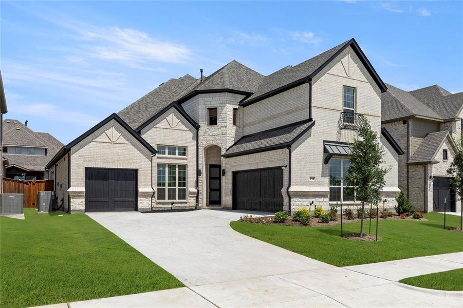 Front exterior of a new home in Gideon Grove, Phase 2, Rockwall, TX, highlighting curb appeal (Image 2). Front exterior of a new home in Gideon Grove, Phase 2, Rockwall, TX, highlighting curb appeal (Image 2).