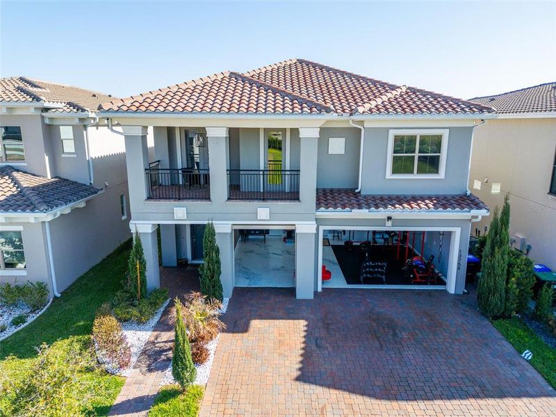 Front exterior of a new home in , Orlando, FL, highlighting curb appeal (Image 26).