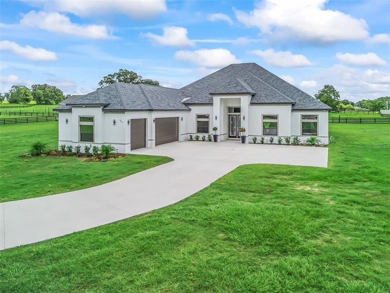 Front exterior of a new home in , Ocala, FL, highlighting curb appeal (Image 27).