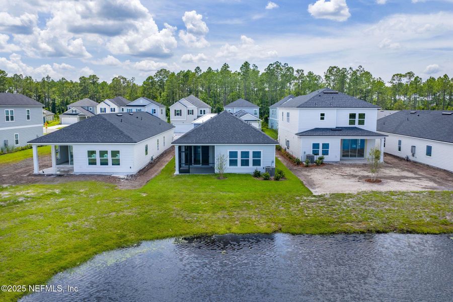 Front exterior of a new home in Beacon Lake, St. Augustine, FL, highlighting curb appeal (Image 24).