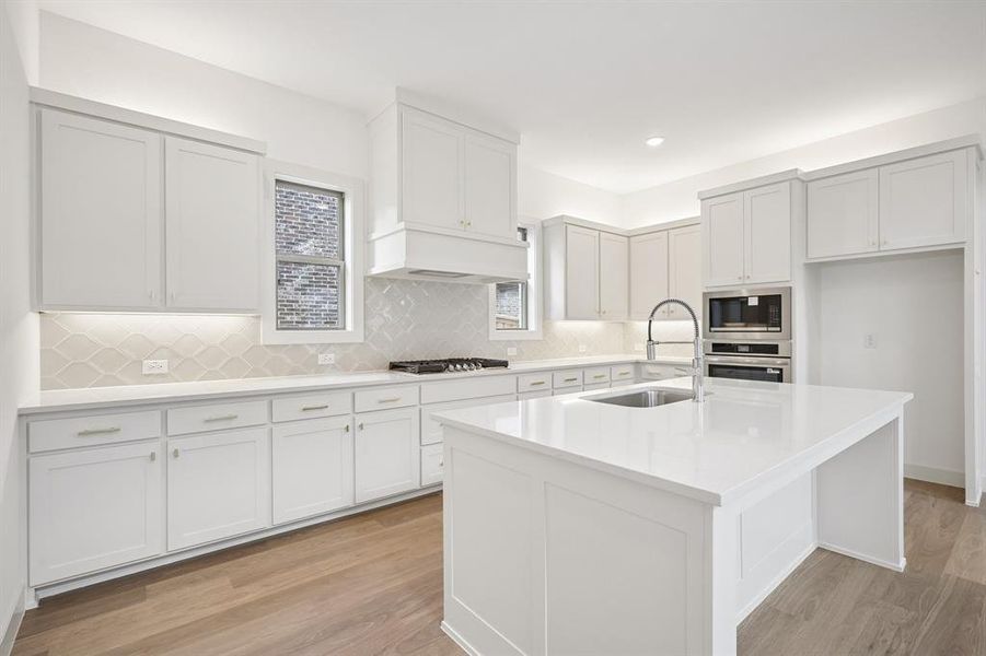 Beautiful cabinetry and gorgeous counter tops paired with contemporary stainless steel create a dream kitchen for the ages!