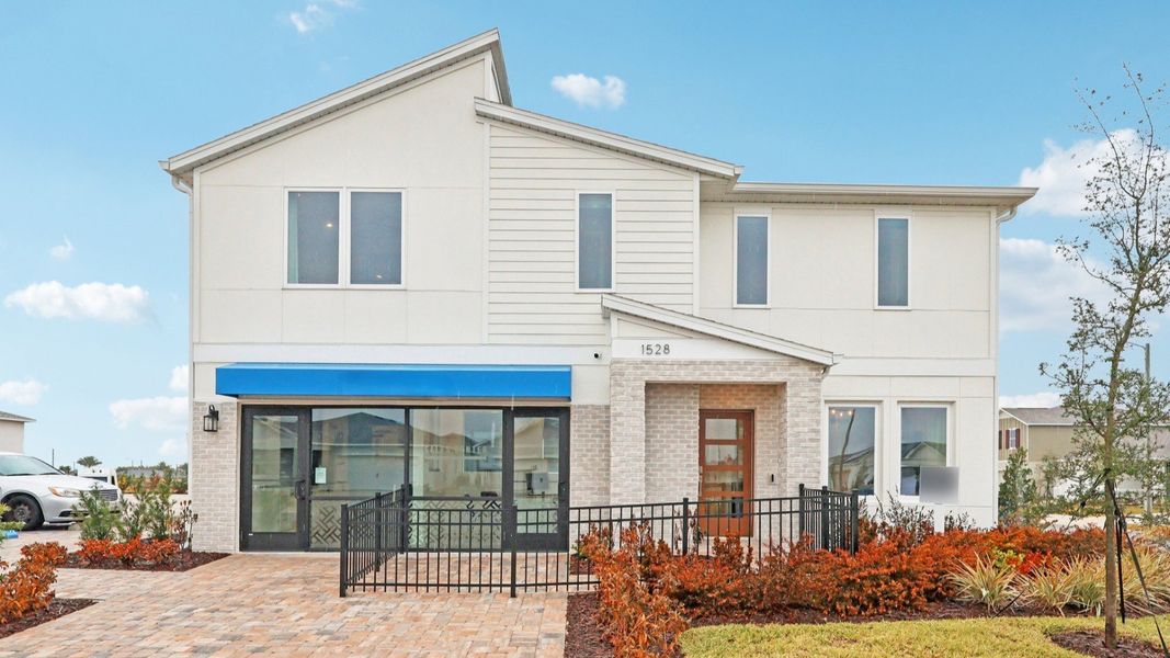 Front exterior of a new home in Hamilton Bluff, Haines City, FL, highlighting curb appeal (Image 1). Front exterior of a new home in Hamilton Bluff, Haines City, FL, highlighting curb appeal (Image 1).