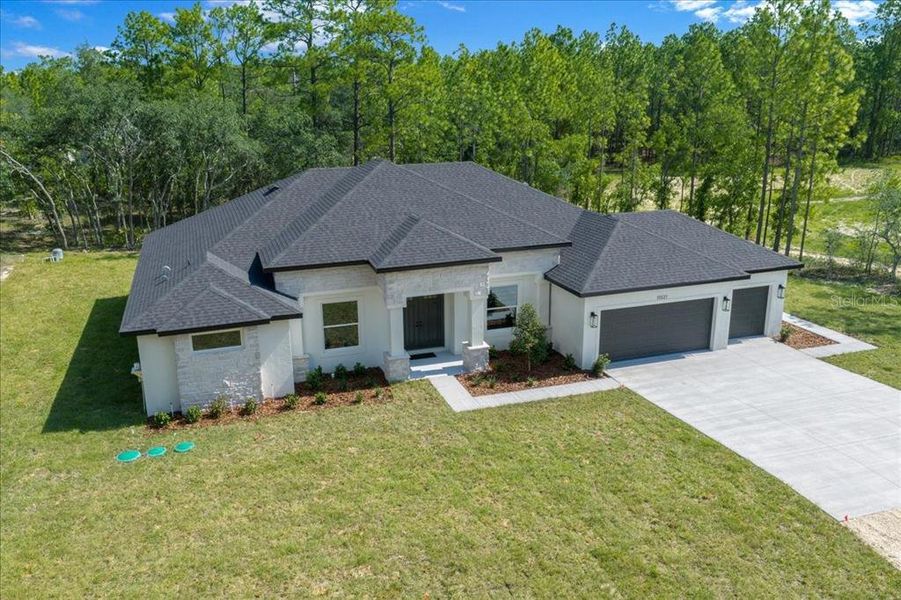 Front exterior of a new home in , Weeki Wachee, FL, highlighting curb appeal (Image 1). Front exterior of a new home in , Weeki Wachee, FL, highlighting curb appeal (Image 1).