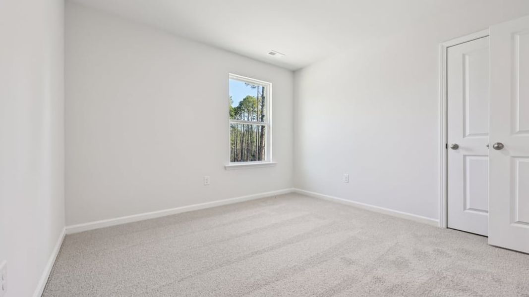Spacious, unfurnished interior of a new home in Gretchen Pines, West End (Image 21).