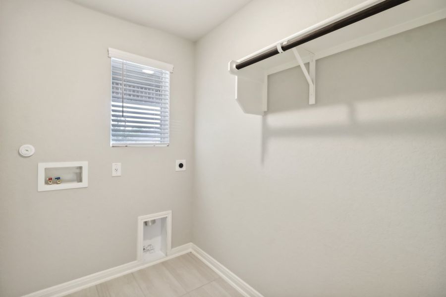 Laundry room in the Cascade floorplan at a Meritage Homes community.