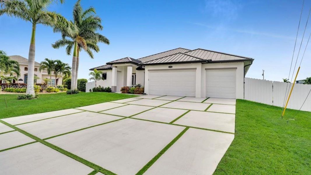 Front exterior of a new home in , Cape Coral, FL, highlighting curb appeal (Image 27). Front exterior of a new home in , Cape Coral, FL, highlighting curb appeal (Image 27).