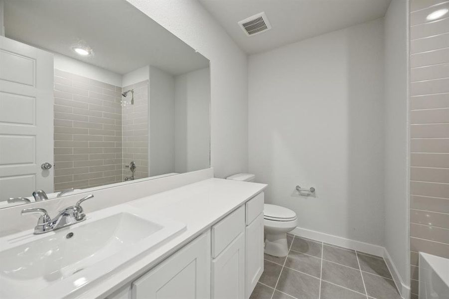 Bathroom in the Haylee home plan by Trophy Signature Homes - REPRESENTATIVE PHOTO