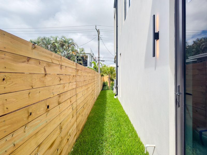 (as of April 8, 2026) side pathway to backyard and cabana bath entry.