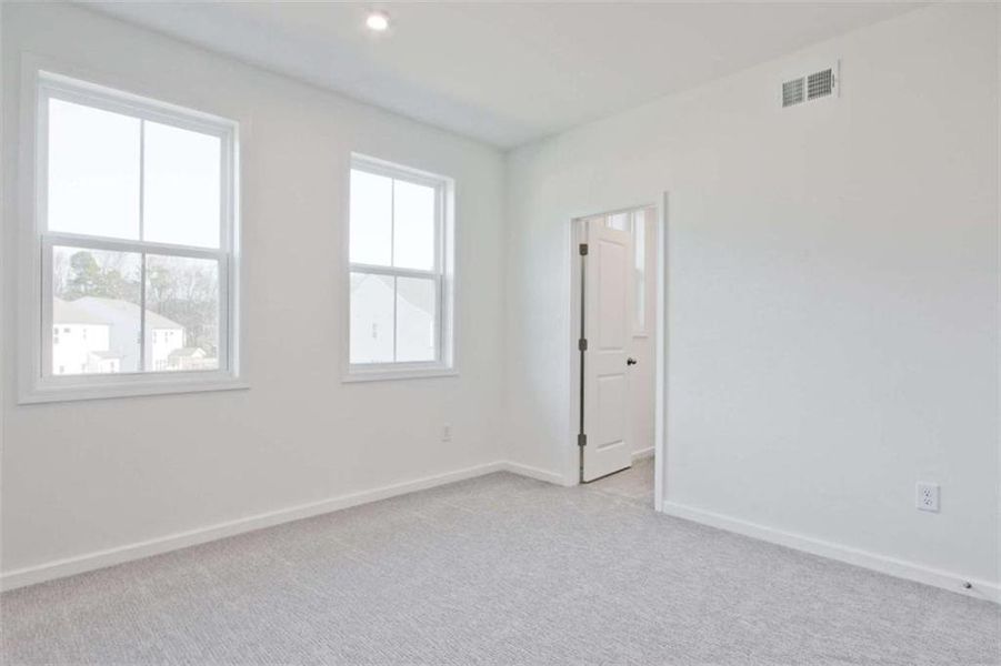 Spacious, unfurnished interior of a new home in The Paddocks at Doc Hughes, Buford (Image 43).