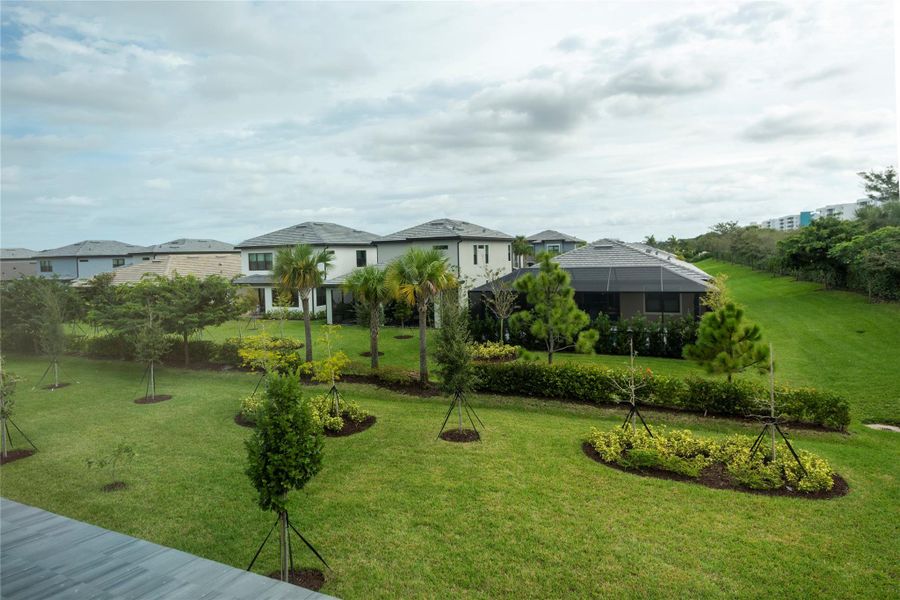 View from Primary Bedroom to large back yard with room for pool.