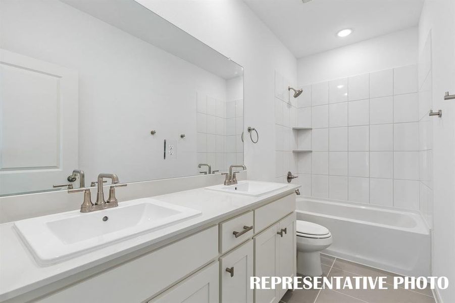 Featuring dual sinks, this guest bath offers guests their own vanity space.  REPRESENTATIVE PHOTO