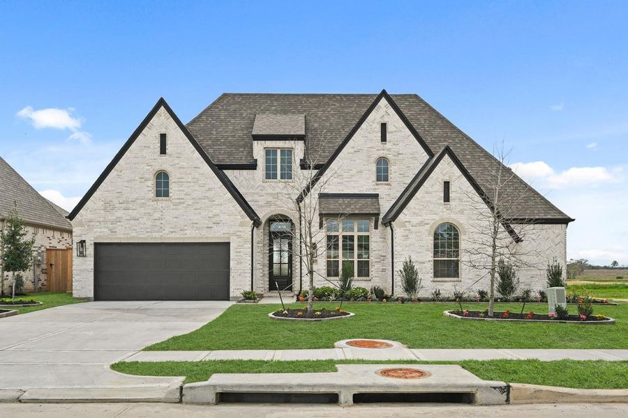 Front exterior of a new home in Briarley, Montgomery, TX, highlighting curb appeal (Image 2).
