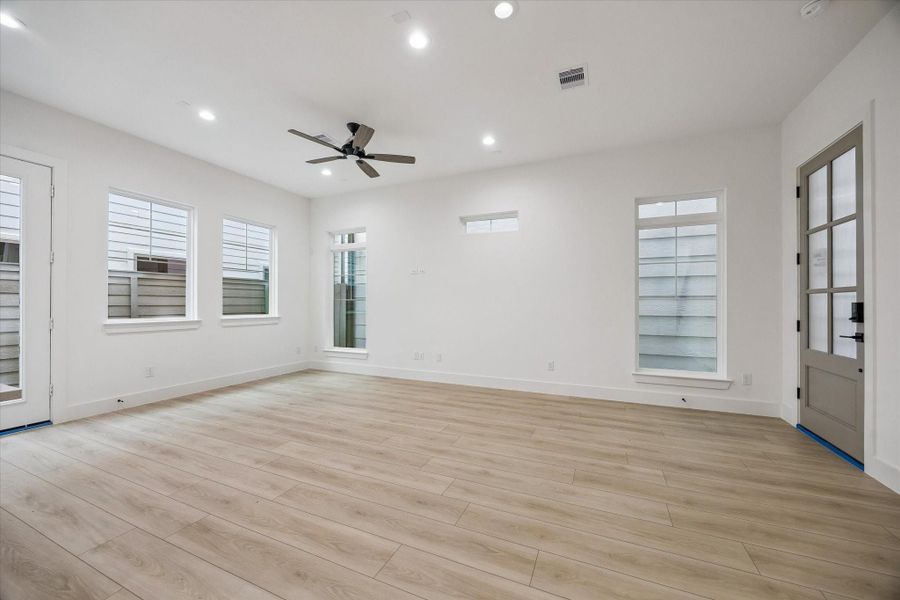 Bright living space with high ceilings, natural light, and modern finishes Bright living space with high ceilings, natural light, and modern finishes