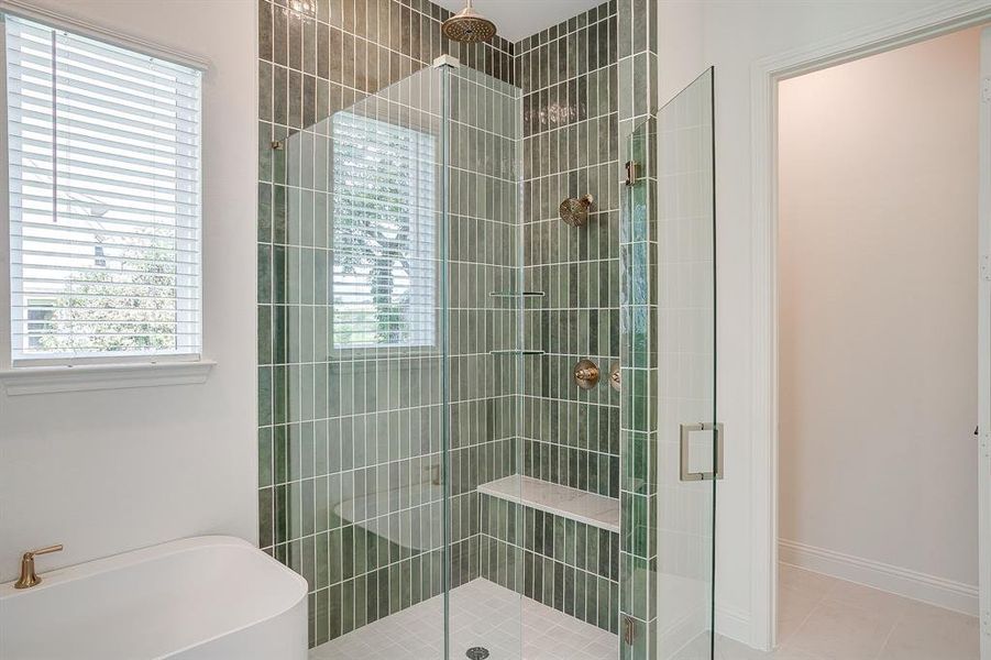 Primary bathroom with a separate shower, double vanity, level 4 Quartz countertops, and a garden tub. Primary bathroom with a separate shower, double vanity, level 4 Quartz countertops, and a garden tub.