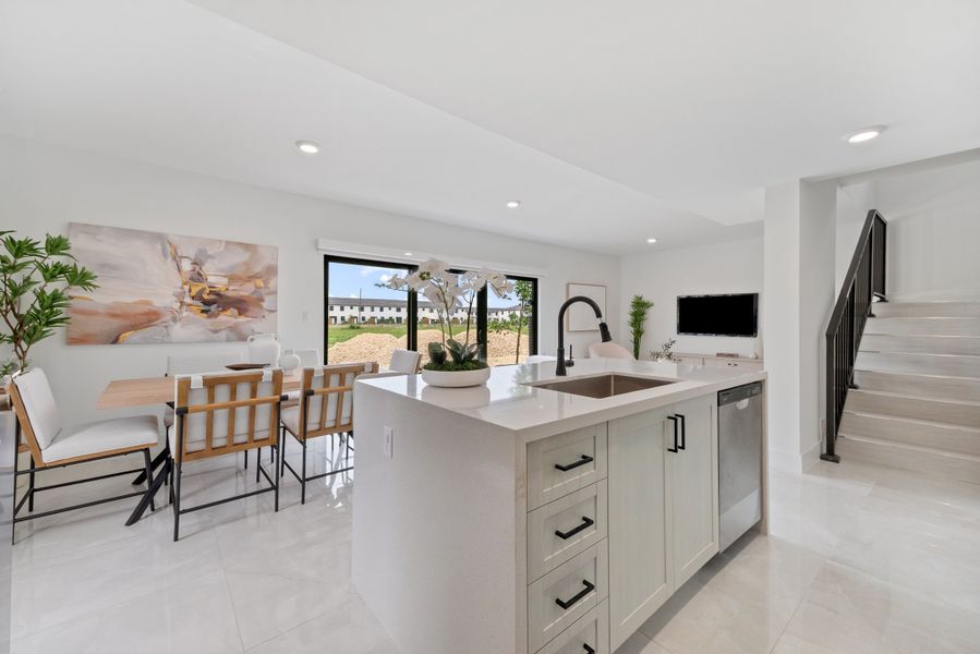 Representative furnished interior of a home built from the Model E by Onx Homes in On Alba, Florida City (Image 37).