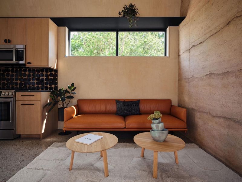 Rammed earth offers a sustainable alternative to conventionalbuilding materials. Locally sourced soils and aggregates minimizeenvironmental impact and the thermal mass of the thick wallsregulates interior temperatures, eliminating the need for additionalinsulation. The result is a structure where form and function meet in perfect harmony.