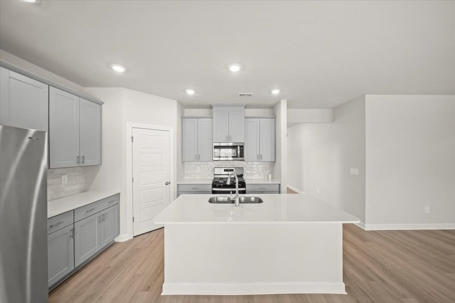 Furnished interior view inside a new home in The Farm at Wells Creek - Signature Collection, Gray Court (Image 4).