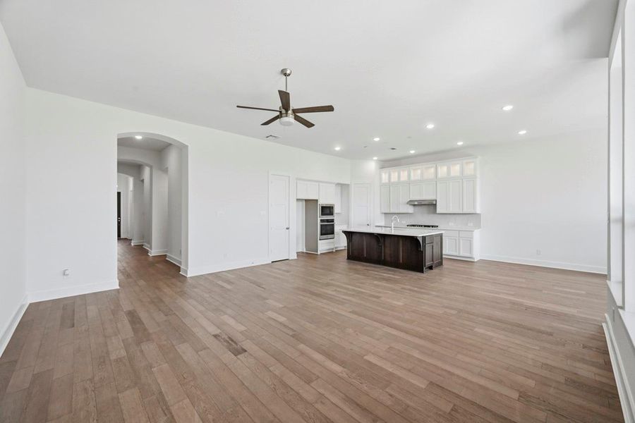Family Room with high ceiling and stacked upper cabinets