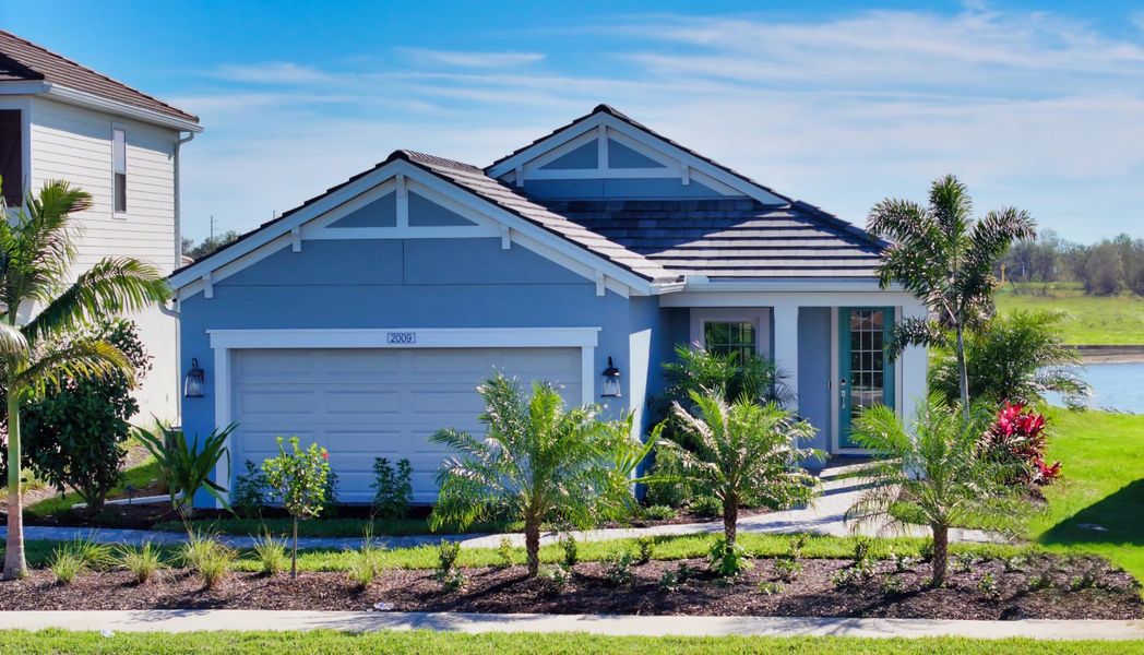 Representative exterior photo of a completed home built from the Liberty 4 by Neal Communities in Palm Grove, Bradenton, FL (Image 22). Representative exterior photo of a completed home built from the Liberty 4 by Neal Communities in Palm Grove, Bradenton, FL (Image 22).