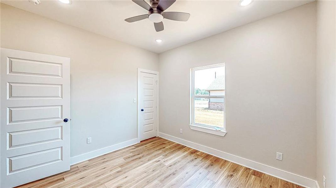 Unfurnished bedroom featuring light wood finished floors, recessed lighting, and a ceiling fan Unfurnished bedroom featuring light wood finished floors, recessed lighting, and a ceiling fan