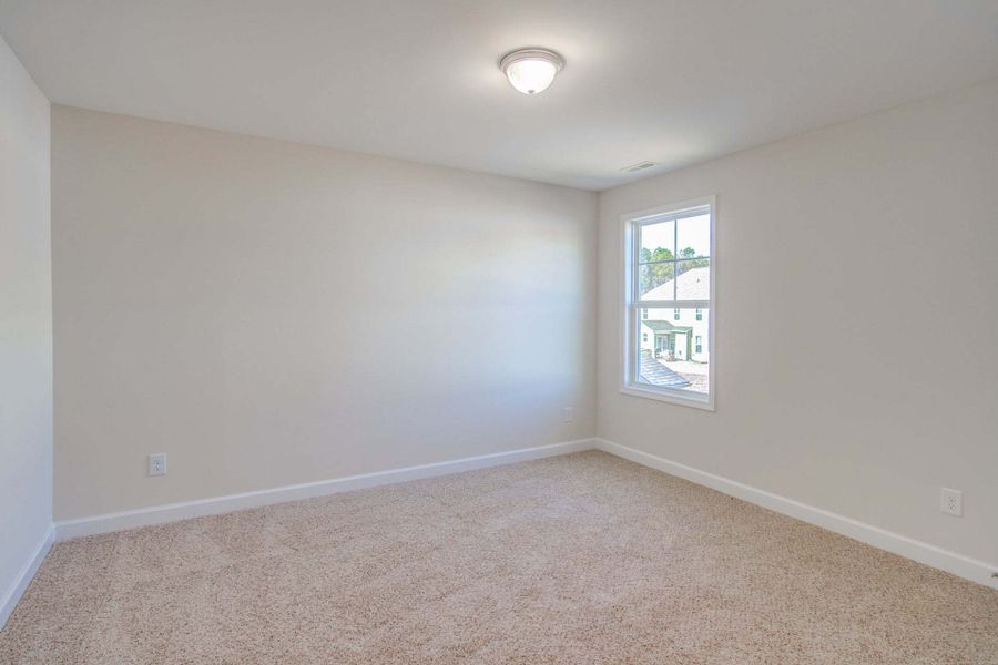 Representative unfurnished interior of a home built from the Drayton by Caviness & Cates Communities in Bartlett Manor, Youngsville (Image 235).