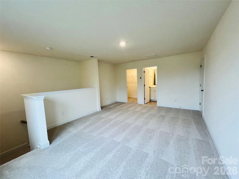 Loft space with walk in closet and full bath