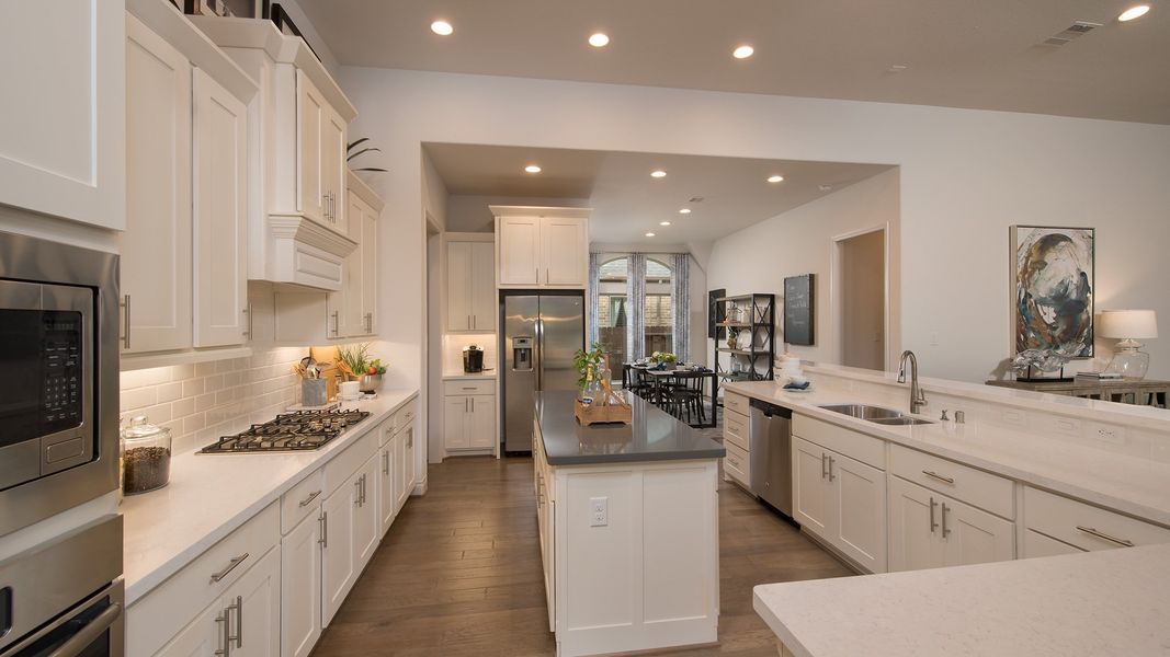 Representative furnished interior of a home built from the 3578W by Perry Homes in Lakes of Cane Island, Katy (Image 39).