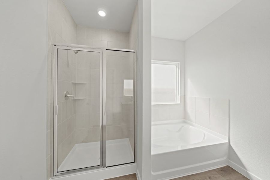 A bathroom with a glass shower.