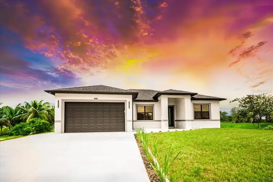 Front exterior of a new home in , North Port, FL, highlighting curb appeal (Image 1). Front exterior of a new home in , North Port, FL, highlighting curb appeal (Image 1).