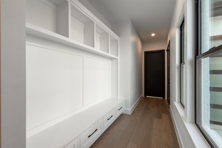 Mudroom with wood flooring