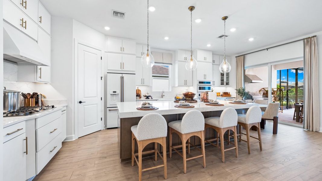 Furnished interior view inside a new home in Esplanade by the Islands, Naples (Image 4).