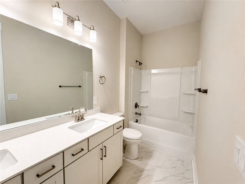 A well-appointed bathroom features a modern vanity